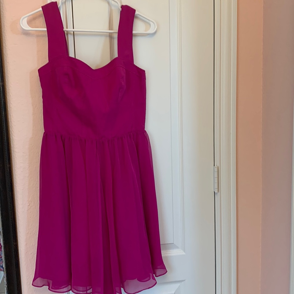 Beautiful dress Brand Dress in perfect conditions never worn color Magenta
